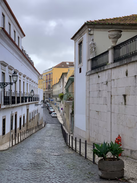 cobblestone street under cloudy sky