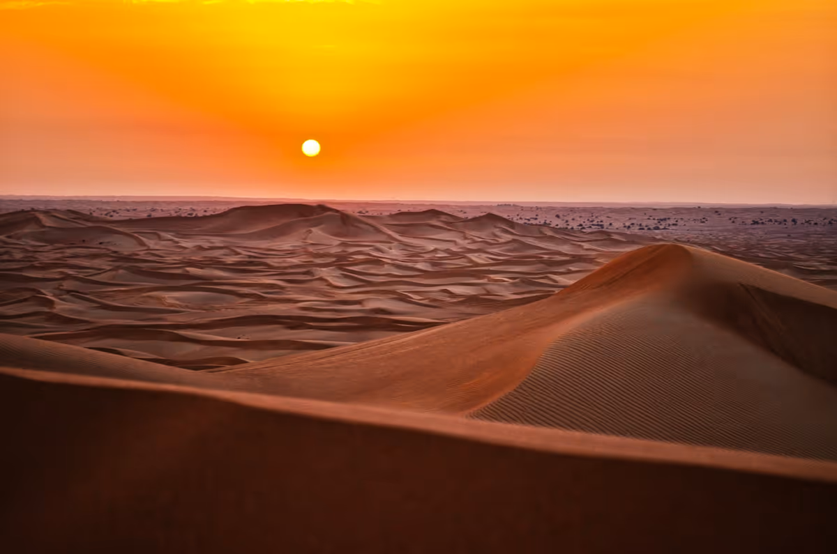sand dunes during sunset