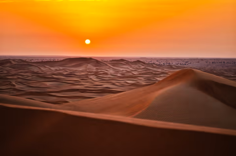 sand dunes during sunset