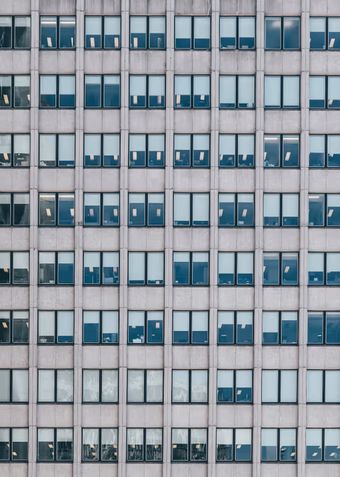 office building with symmetrical gray textured walls