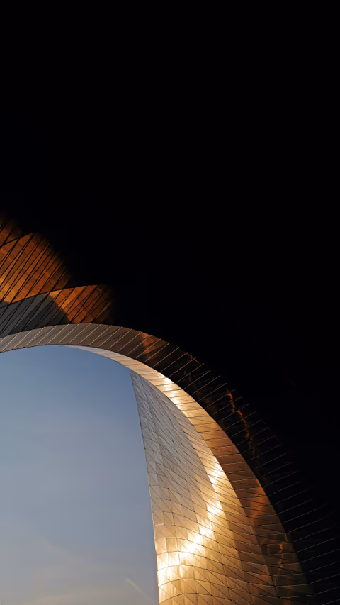 a view of a clock tower through a circular window