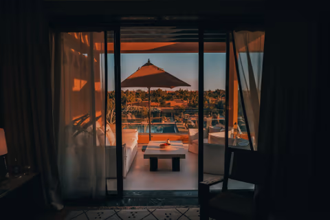 patio table under a parasol at sunset