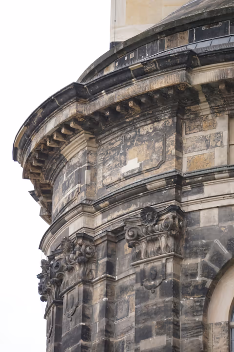 an old building with a clock on the front