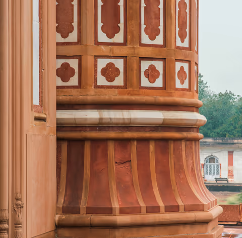 ornate red and white column with intricate patterns
