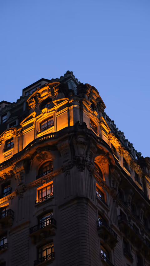 a very tall building lit up at night